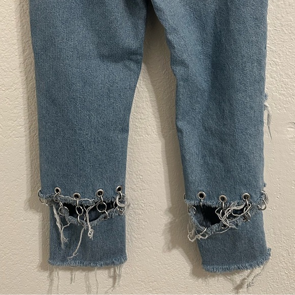 Jeans are cropped at the ankle and wide in the waist. - Picture 9 of 9